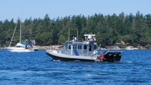 While waiting for Kap's airplane to arrive, the Customs and Border Patrol boat that's frequently around Roche Harbor departed. Note the 3 - 300hp Mercury outboard engines on the back of this inflatable. I can't imagine anyone can outrun this boat!