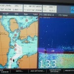 The chart plotter image shows just how narrow Pole Pass is. Flying Colours is the boat-shaped black image near the bottom, and the red squares and connected lines show our intended course. It's a no-wake area here to protect the shoreline, and there are many shallow areas on approach, plus some rocks just below the surface, so lots of caution is necessary.