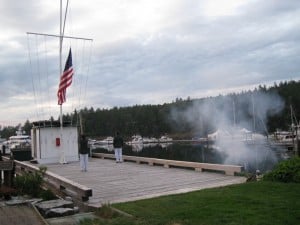 At the head of the main dock, the flags of all nations for boats in the marina are flown. At 2 minutes before sundown each evening, the resort staff hold a "Colors Ceremony", beginning with a canon salute, folowed by the national anthem as each country's flag is lowered. The smoke was from the just-fired canon - which is about the same size as one I have at home. 