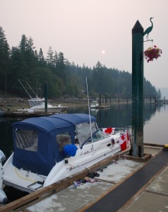 Sunrise from Gorge Harbour.  The smoke in the air from the forest fires made it look almost like a harvest moon.  The 24' boat next to us was from Campbell River and had four adults and 4 small children sleeping aboard it.  We can't imagine where they all slept.