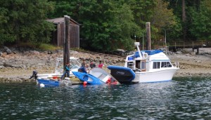 An ignominious start to a day's cruise - to lose your dinghy and a kayak over the side.  This boater tried to leave Gorge Harbour at the same time as us, with not-so-good consequences.