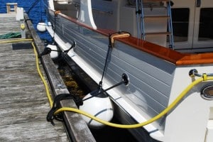 Flying Colours against the dock, with fenders holding us off about 16” – plenty of room for ZuZu to land in the water.