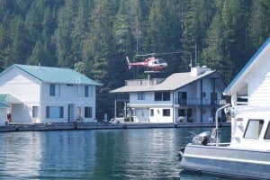 A float home at the “street” behind where Flying Colours was moored – caught at the moment when the owner was lifting off with his Robertson helicopter for the afternoon’s grocery shopping (I saw them return and exit the helicopter with grocery bags in their hands – pretty expensive trip to the store.  Some of the float home owners are pretty well-heeled!)