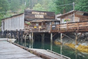 The Refuge Cove Store.  It’s mostly perched on pilings along a rocky shore of Refuge Cove.  It’s sort of a boardwalk community, with rickety boardwalks on pilings connecting the store to several other one-person businesses and homes.  The building to the right is the shower block, where you can get a hot water shower (without a timer) for a loonie (C$1).