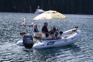 An interesting couple cruised past us several times in their “Doggy Dinghy” – with three yappy floor-mop dogs.  They stopped by one time to tell us about a better “goin’ ashore” spot for the dogs.  Someone has cleared a dinghy landing area about 5’ wide, and it’s easy access to shore on either high or low tide.