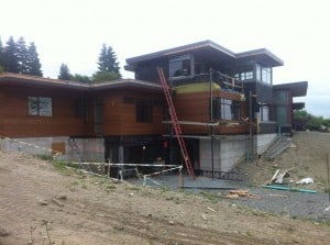 The new house, now within about 5 months of completion.  Cedar siding is about 3/4ths complete, the stone siding that is on a rail car from Vermont is almost here, interior drywall is complete, kitchen tiling is complete, and quite a few interior projects are being worked on.