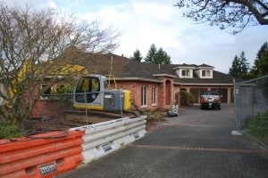 The house we tore down last April - because the construction of it just wasn't up to standards for an extensive remodel that we needed to get away from the Leave It To Beaver current style - but more importantly, a floor plan that just didn't work.  The entire house wasn't right for us, and we finally concluded that a teardown and new construction was the only way to go.